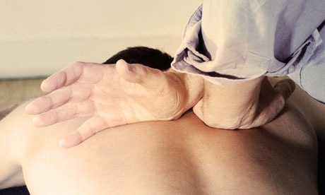 Chiropractor treats a patient